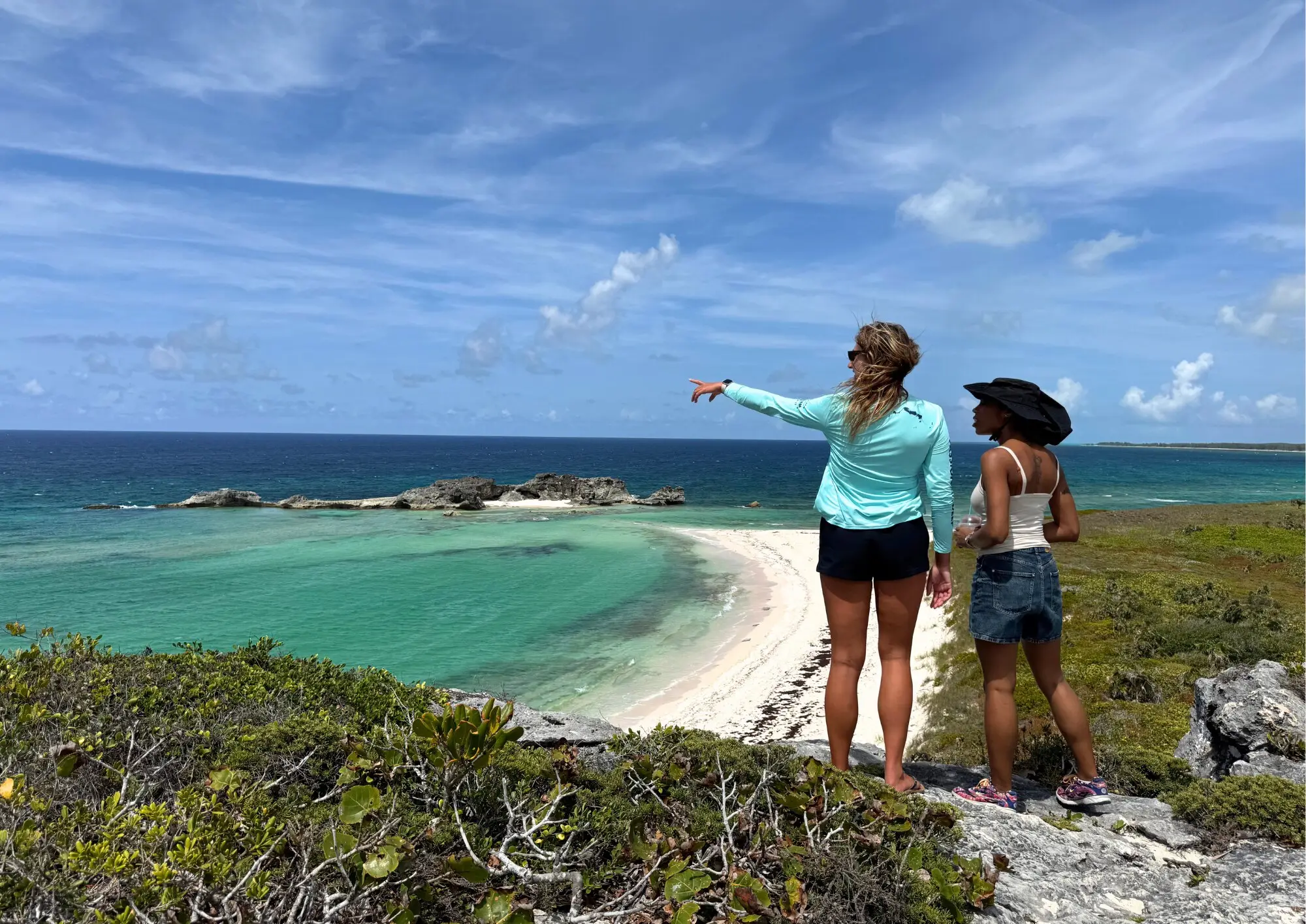 A Big Blue guide pointing out the coastline to a guest