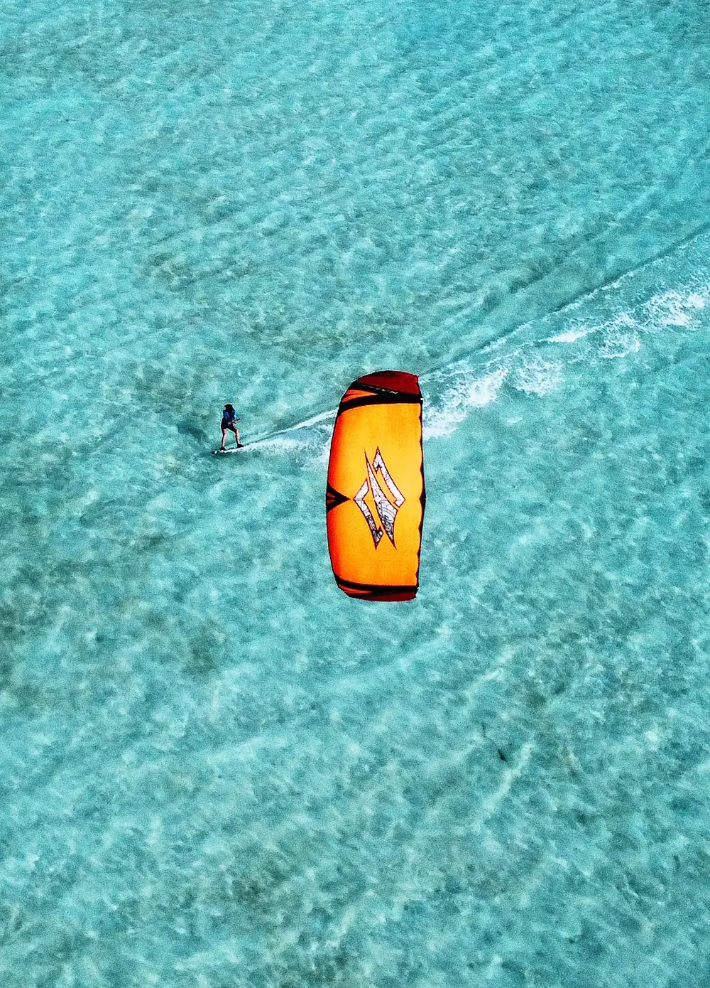 Aerial view of kiteboarders over shallow flats