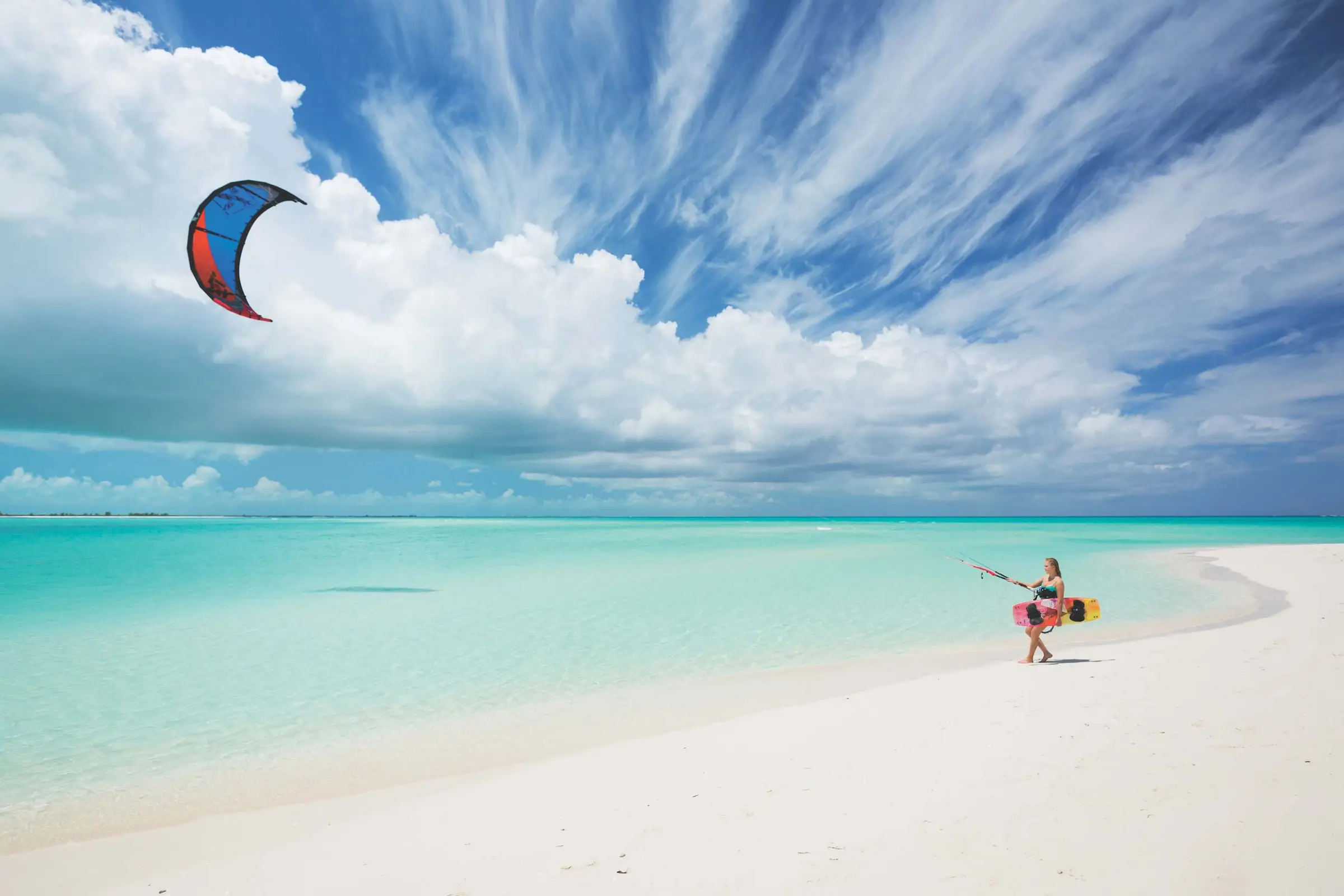 Kiteboarder on a white beach under a big sky